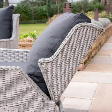 Talia L-Shaped Grande Rattan Dining Set with Reclining Armchair & Bench - Rising Table